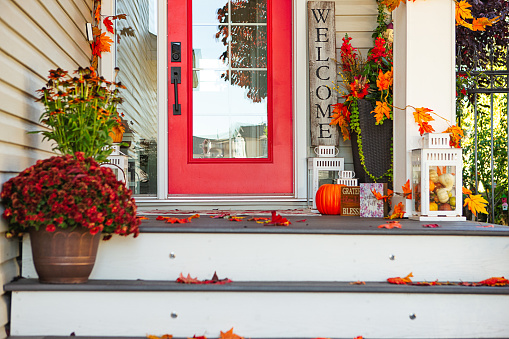 Front porch decorated for Fall.