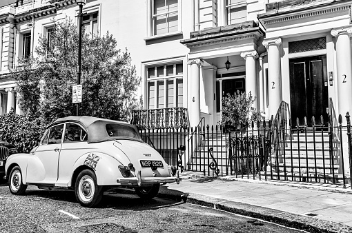 London, England - July 11, 2023: Vintage car parked in the Knightsbridge district of London