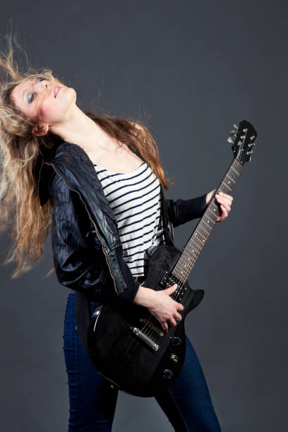 istock Girl playing guitar 162422105