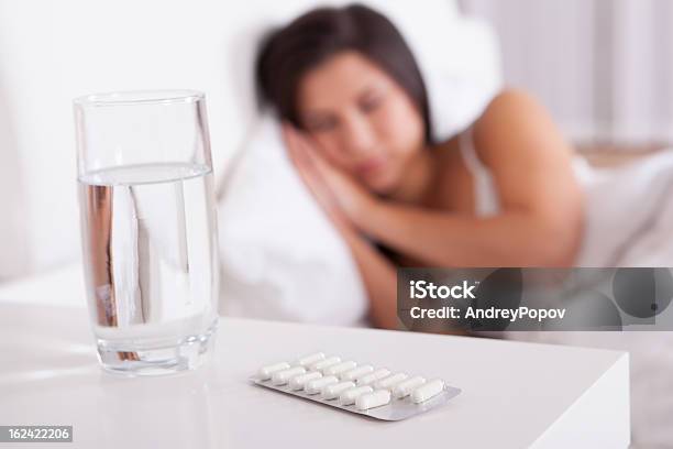Sick Woman Resting In Bed Stock Photo - Download Image Now - Adult, Antibiotic, Beautiful People