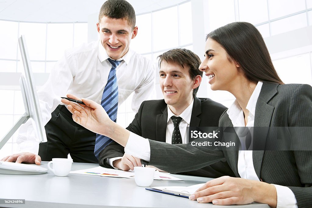 Business people Smiling business people  in board room Adult Stock Photo