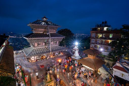 Devotees pictured as they circumambulate Bagh Bhairab temple on the occasion of the Bagh Bhairab festival celebrated at Kirtipur, Kathmandu, Nepal on Friday, August 18, 2023. On the occasion of Bagh Bhairab festival, devotees used to round Bagh Bhairab Temple for 108 times for blessings with success and good health.