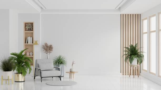 istock Modern minimalist interior with an armchair on empty white color wall background. 1624291940