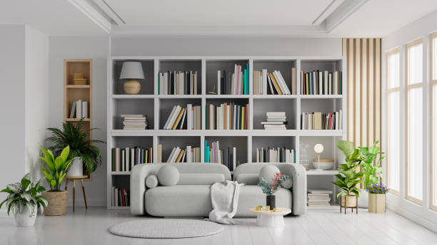 Library in the living room with gray sofa on empty light white color wall.