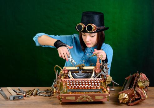 Steam punk girl repairing typewriter. Dark green background.