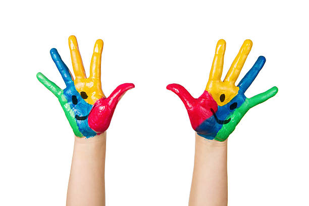 istock Smiley faces on colorful child hands 162431417