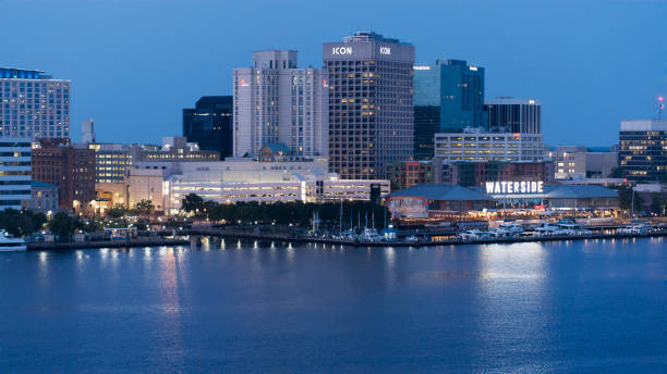 istock Night comes to illuminated Downtown. Twilight Norfolk skyline along Elizabeth River harbor.  Portsmouth - Norfolk, VA. 1624324232