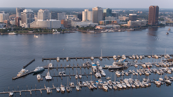Elizabeth River harbor and coastal city life. Houses and building along the riverside.  Boat jetty and Norfolk aerial view from Portsmouth, VA