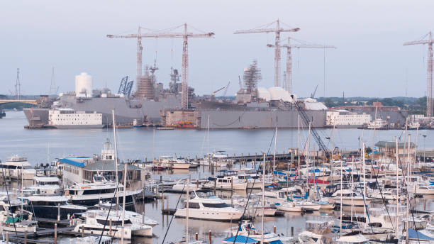 Dynamic Shipyard operations near Midtown Tunnel: Gantry cranes and maritime activity in action at Nassco Shipyard, Norfolk, VA