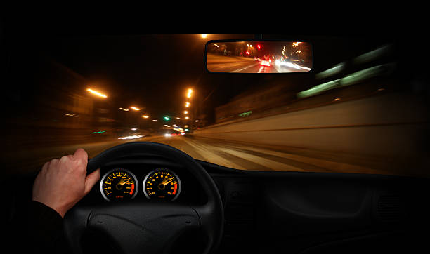 Driver going very fast through the town View from car cabin. SEE my other pictures from my "Drive" lightbox:  driving steering wheel stock pictures, royalty-free photos & images