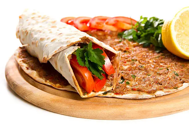 Turkish specialty pizza with parsley and lemon