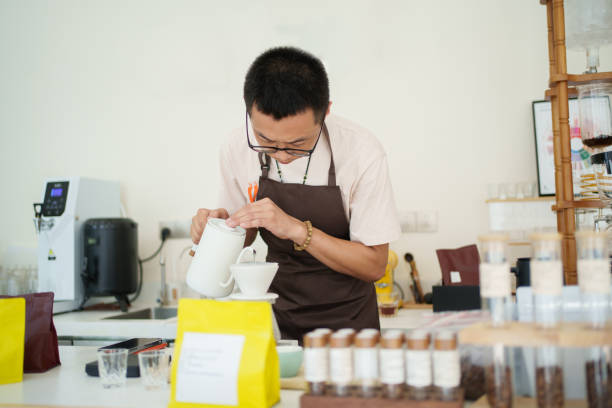 istock Barista working in coffee shop 1624365176
