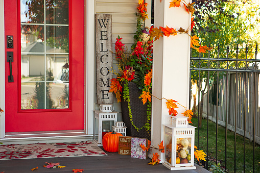 Front porch decorated for Fall.