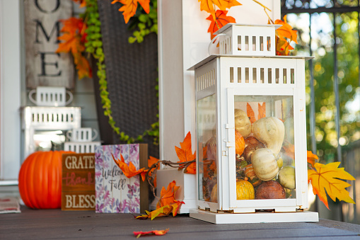Wooden Front porch decorated for Fall.
