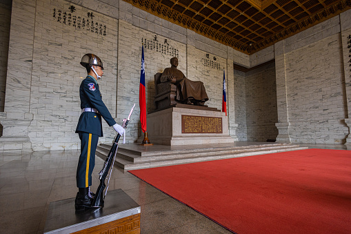 Taipei, Taiwan - May 21, 2023: The guard at the Chiang Kai-shek memorial hall. The soldier stands an hour and guards the memorial before the changing of the guard comes. Inside the memorial park