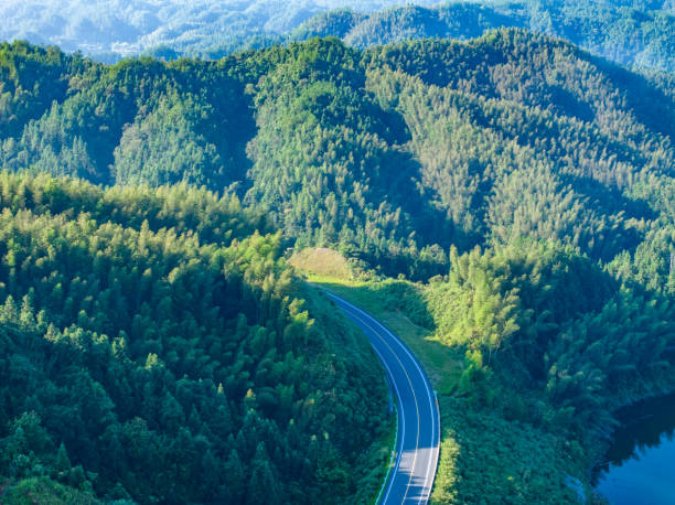 istock winding mountain road, mountain road 1624412124