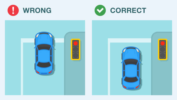 istock Safe driving tips and traffic regulation rules. Stop line rule. Blue sedan car stopped at red traffic light. Top view. 1624413372