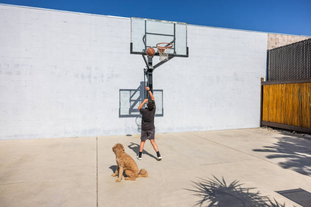 Boy Playing Basketball stock photo