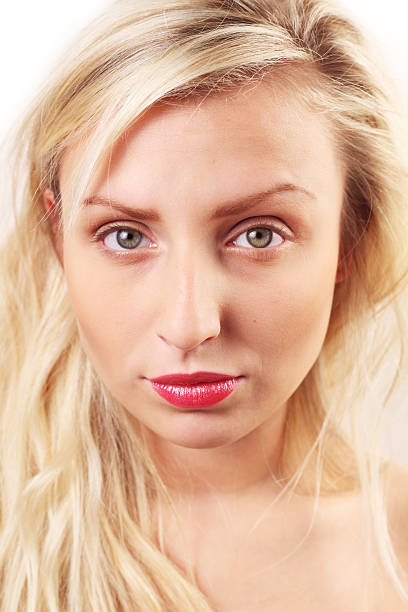 Portrait of a girl with light makeup and styled blond hair
