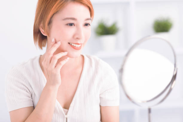 istock Young asian beauty Looking At Mirror 1624416008
