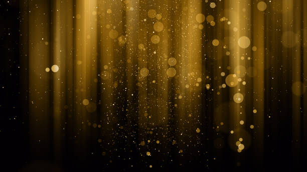 istock Particles gold glitter bokeh award dust abstract background 1624416381