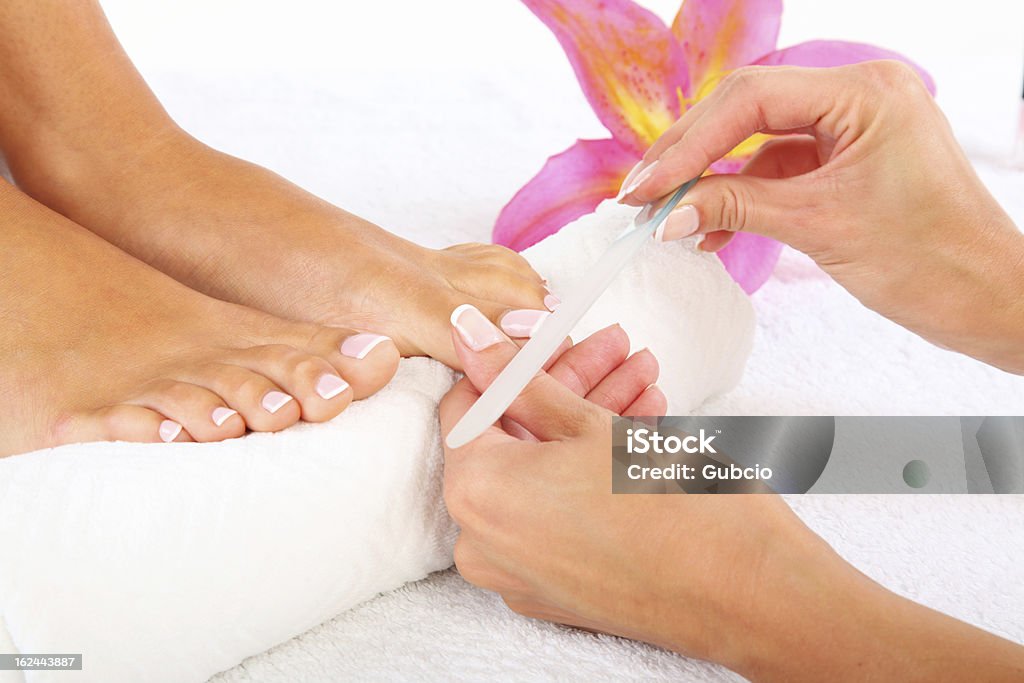 Pedicure Beauty treatment photo of nice pedicured feet Adult Stock Photo
