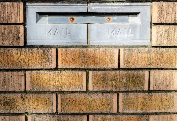 istock Metal old style mailbox on red brick walls. 1624442237
