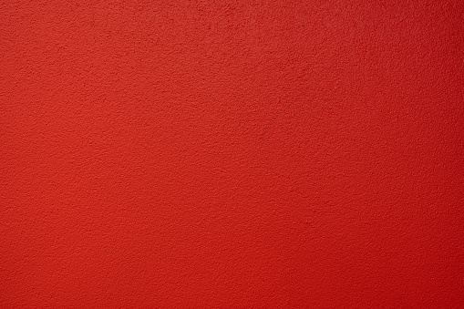 closeup photo of red textured wall as background