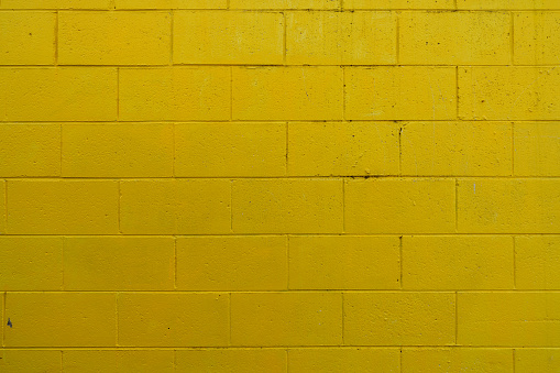 yellow colour brick wall as a background