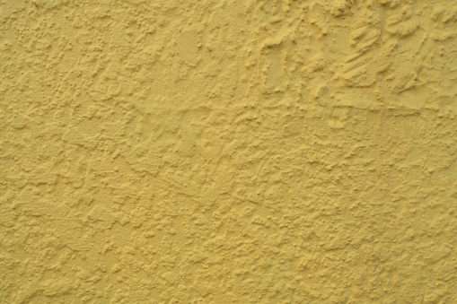 Yellow concrete wall texture background