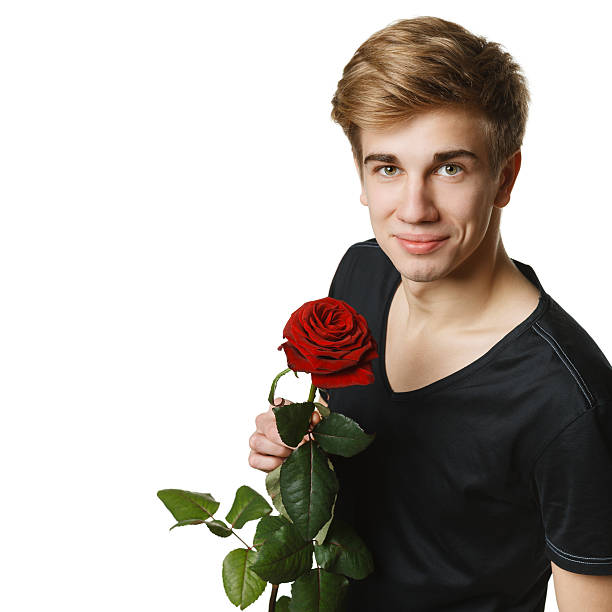 istock Young handsome man holding the red rose 162447287