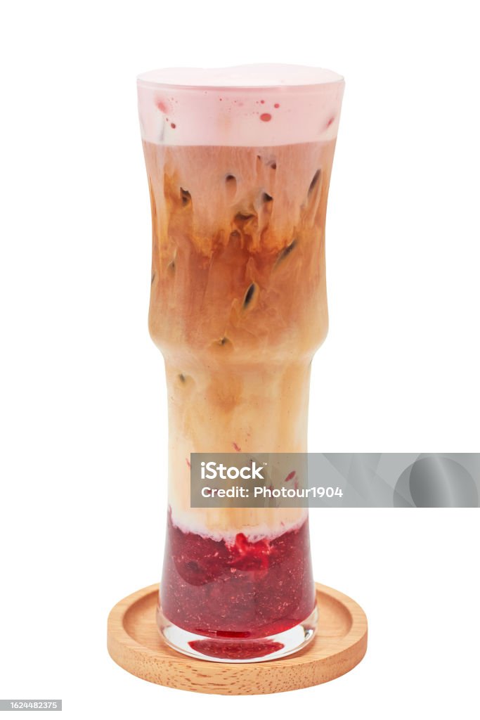 Iced Strawberry Latte in high glass isolated on white background. Iced Strawberry Latte served clearly separated layers (strawberry, milk, coffee and strawberry milk foam). caffeinated beverages. Alcohol - Drink Stock Photo
