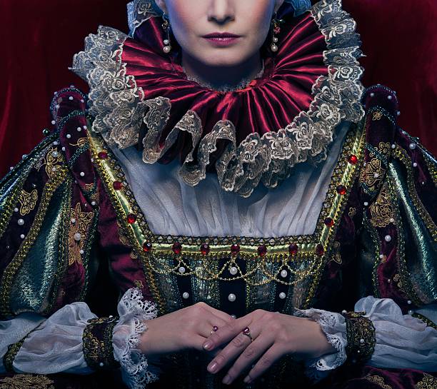 Queen in royal dress and luxuriant collar stock photo