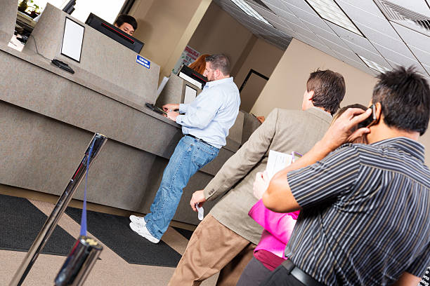 Line Of Customers At The Bank Stock Photo - Download Image Now