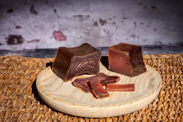 Photo of Tacos and slices of cured tuna loin, called in Spain mojama, a delicacy of Arab origin produced on the southern coast of Spain, close-up.