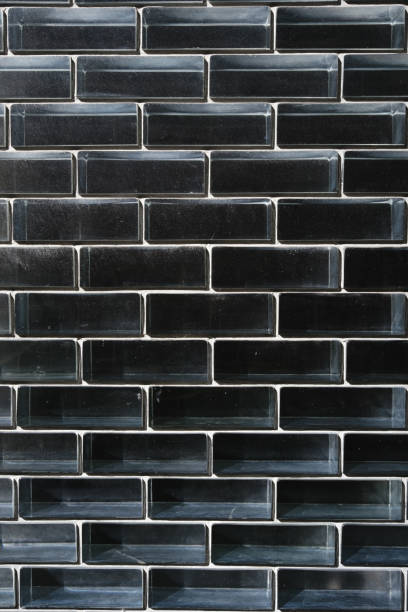istock Part of a clear glass brick wall with dark background 1624560570