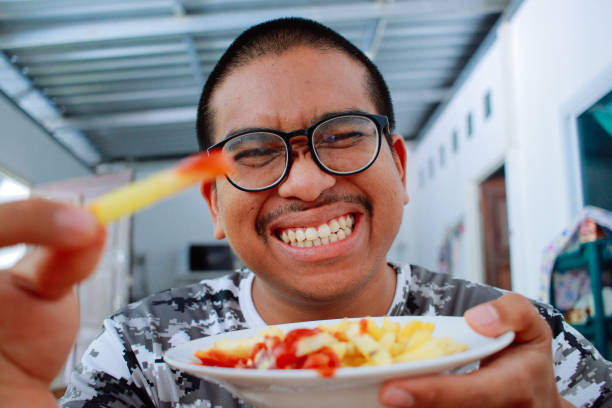 istock man enjoy fries 1624585478