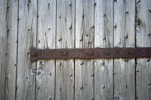 Wooden sign hanging on a rope on white background