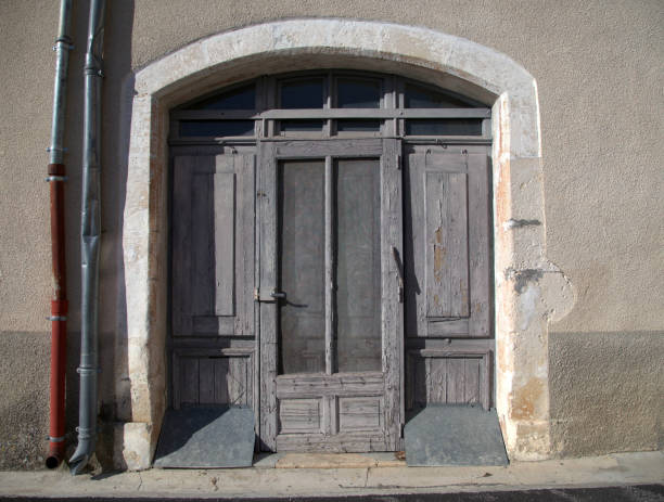 Old wooden door to a house in a medieval french town