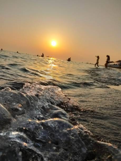 istock sea, beach, sunset, sun, sand, wave, 1624636948