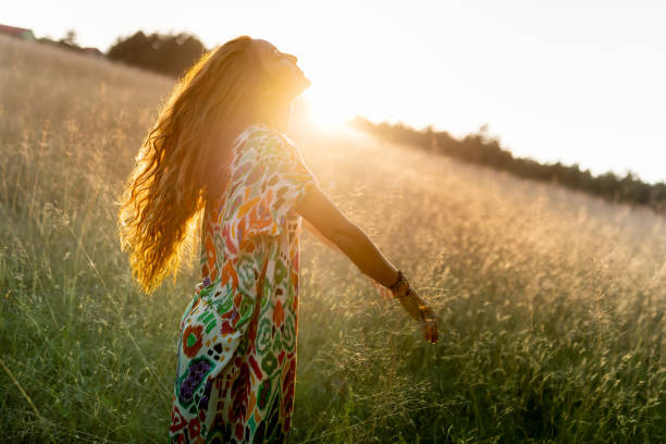 istock A young woman dancing in a field enjoying the sunset 1624680755
