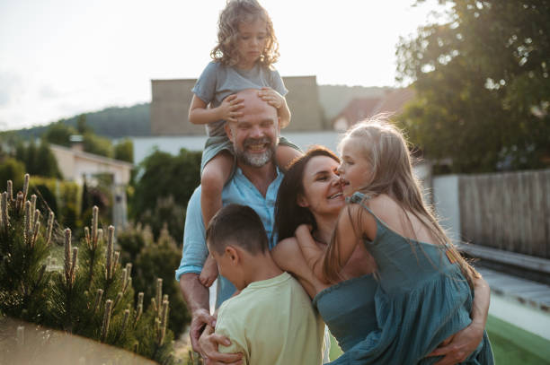istock Cheerful family with three kids having fun together in kitchen. 1624698504
