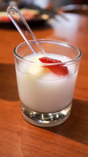 istock Vanilla jelly pudding with banana and strawberry fruit slice dessert appetizer in a small glass cup. 1624728147