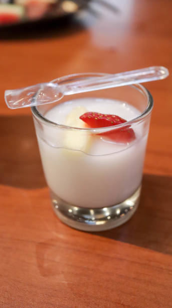 istock Vanilla jelly pudding with banana and strawberry fruit slice dessert appetizer in a small glass cup. 1624728152