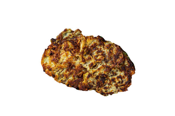 istock Potato pancakes with  herbs and salt on wooden board.  High quality Isolate, white background. 1624841072