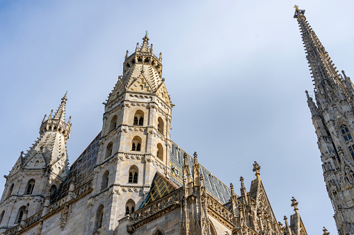 Towers of St. Stephan Cathedral or Stephansdom, the mother church of the Roman Catholic Archdiocese of Vienna, located in the city center of Vienna, Austria.