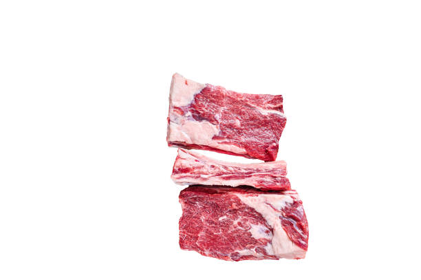 istock Raw beef calf short ribs meat on a butcher cutting board with cleaver.   High quality Isolate, white background. 1624856967