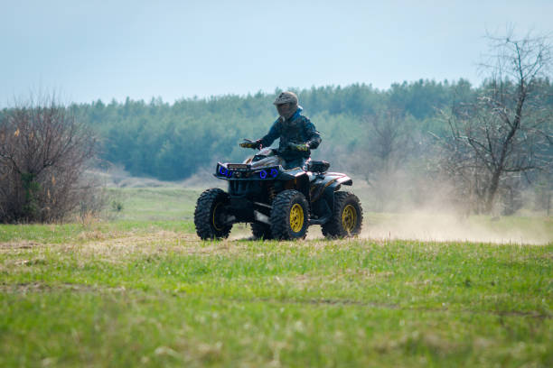 istock ATV and UTV offroad vehicle racing in dust. Extreme, adrenalin. 4x4 1624860295