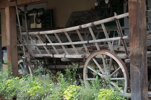 an old and obsolete agricultural machinery standing on a farm