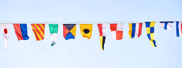istock Signal flags on ship on sky background 1624881859